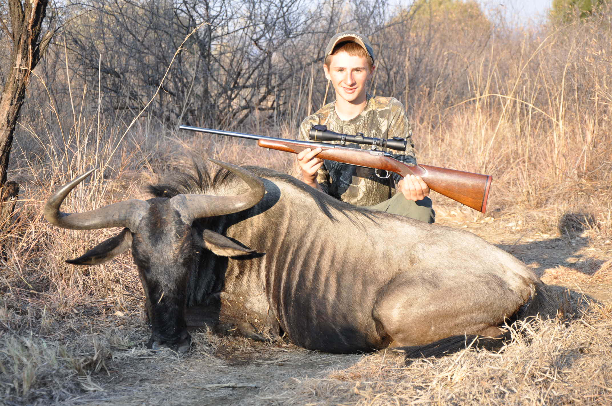 My son and his record book Blue Wildebeest taken with his 280.
