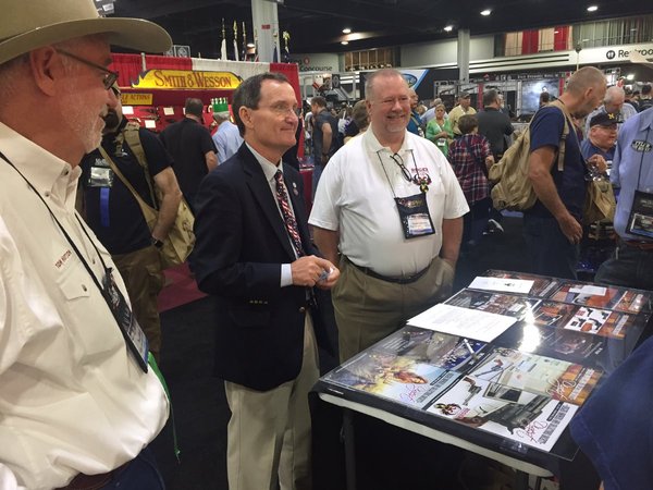TOM HUTTON, MIKE FIFER, RUGER CEO, &amp; DAVE LORTSCHER AT DISPLAY BOOTH