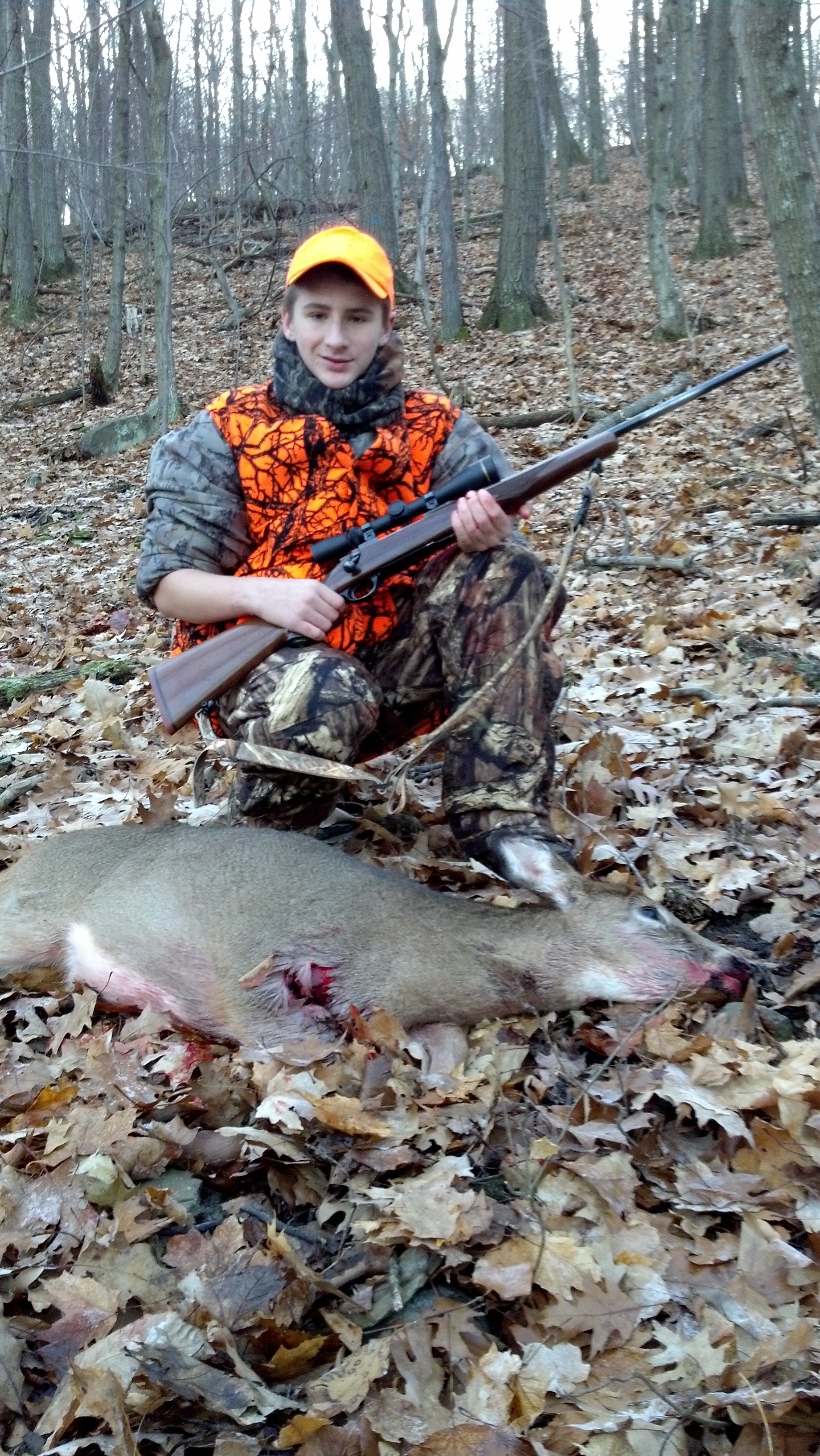 My son and his first deer.